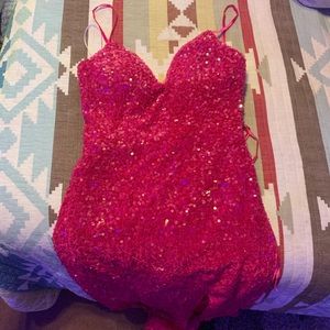 I’m selling a a sparkly hot pink formal dress with a slit up the leg!